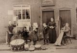 Owen family playing music outside Post Office, Forsbrook area
