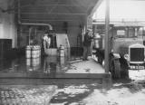 View of the unloading of milk churns, Uttoxeter area