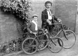 Leamington Spa.  A man and a boy with bicycles